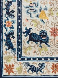 A Chinese Silk Rug with Lions