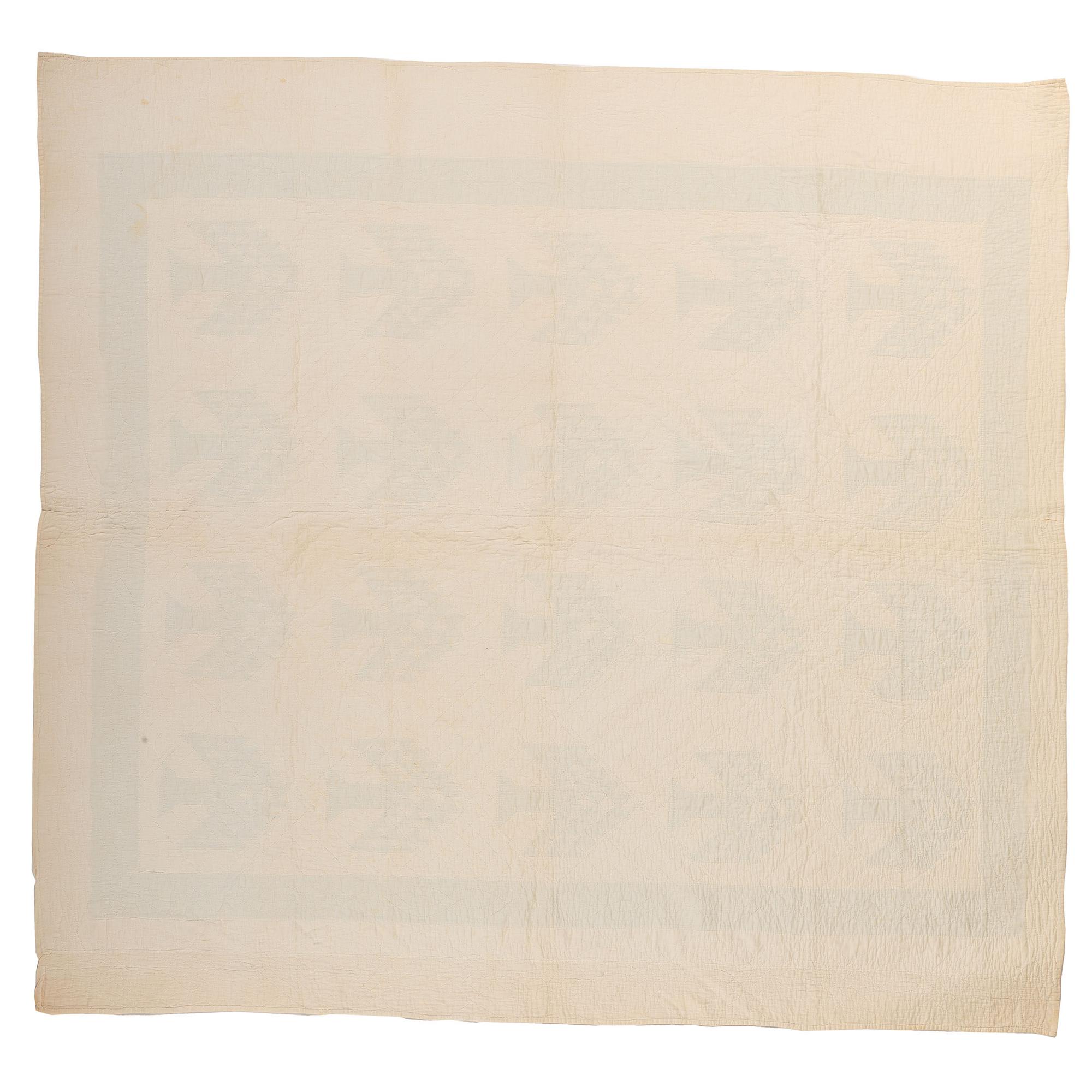 A Green and White Tree of Life Quilt