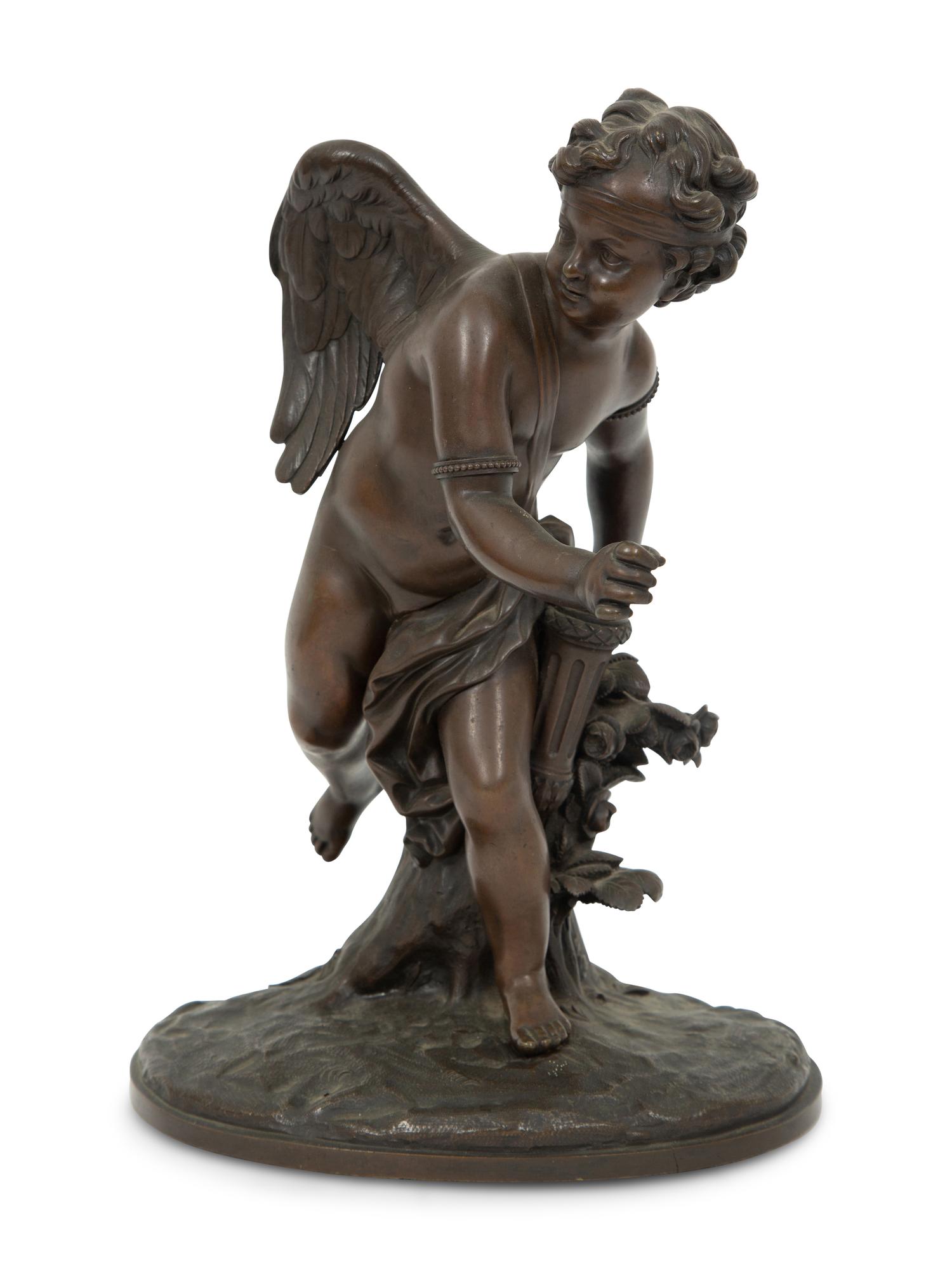 A French Bronze Figure of Eros on a Wood Base