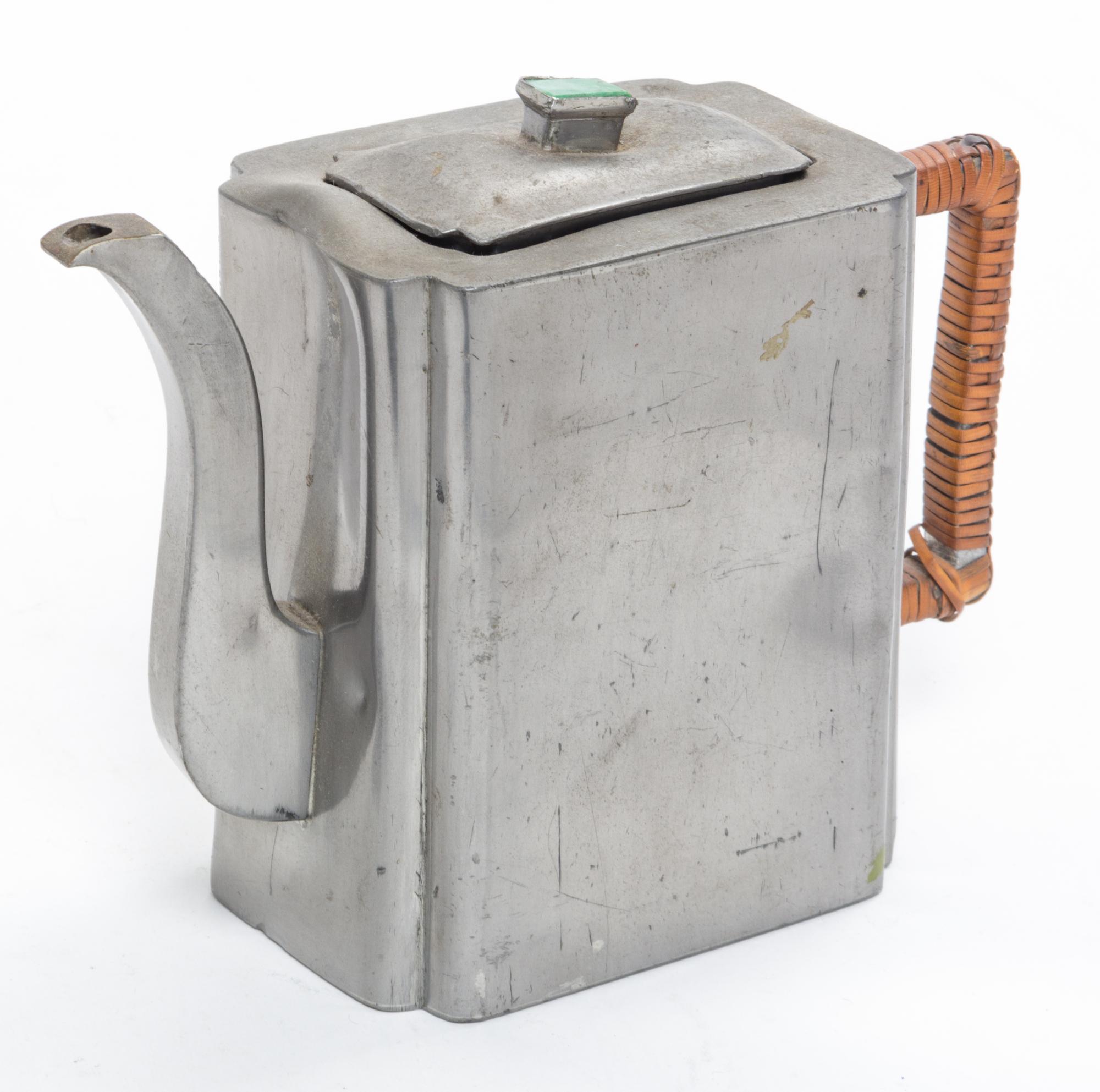 A Chinese Pewter Teapot Height 5 1/2 inches overall.