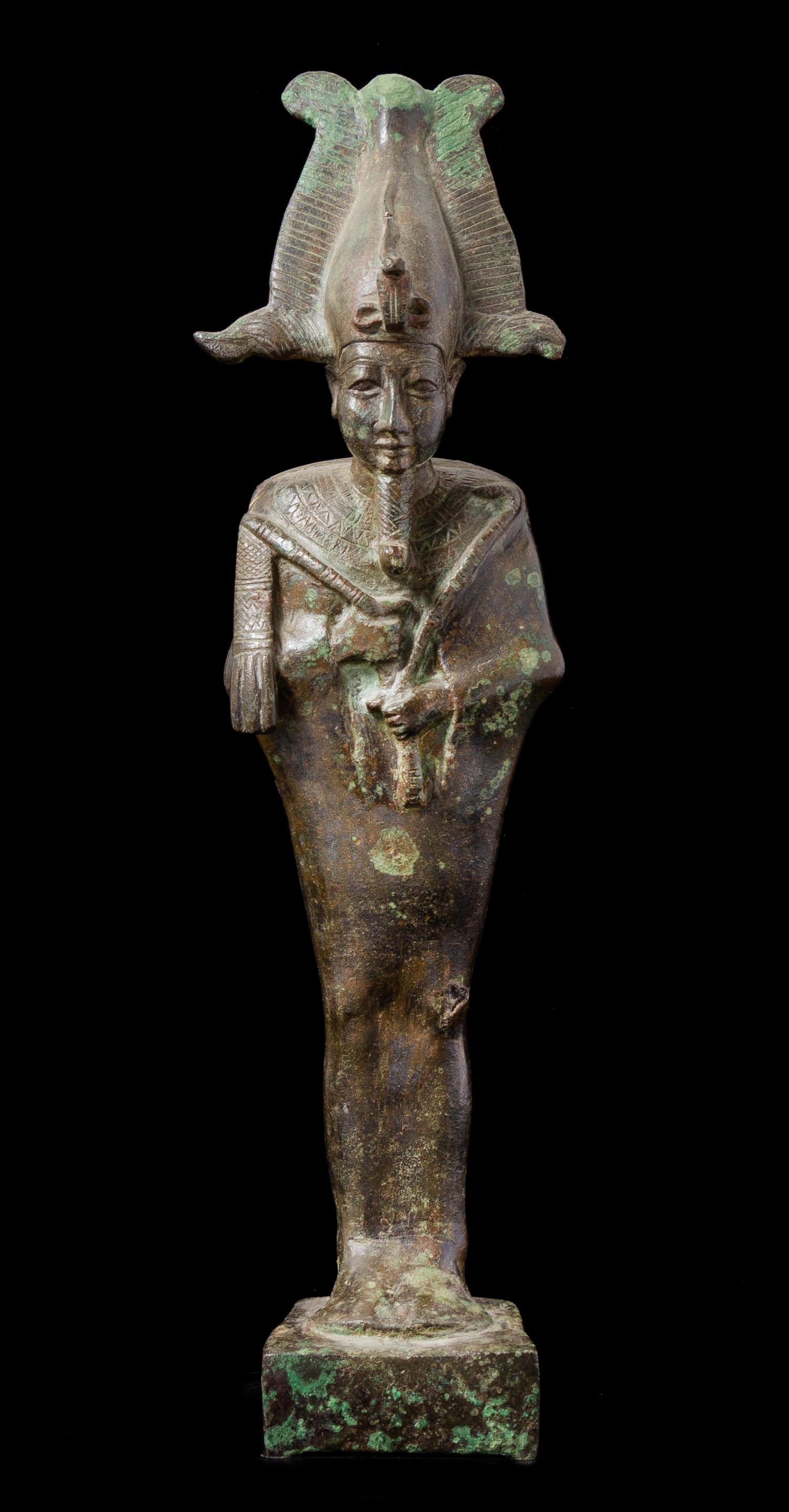 An Egyptian Bronze Standing Osiris Height 11 inches. — LATE PERIOD, DYNASTY 26-30, 664-343 B.C.E.
