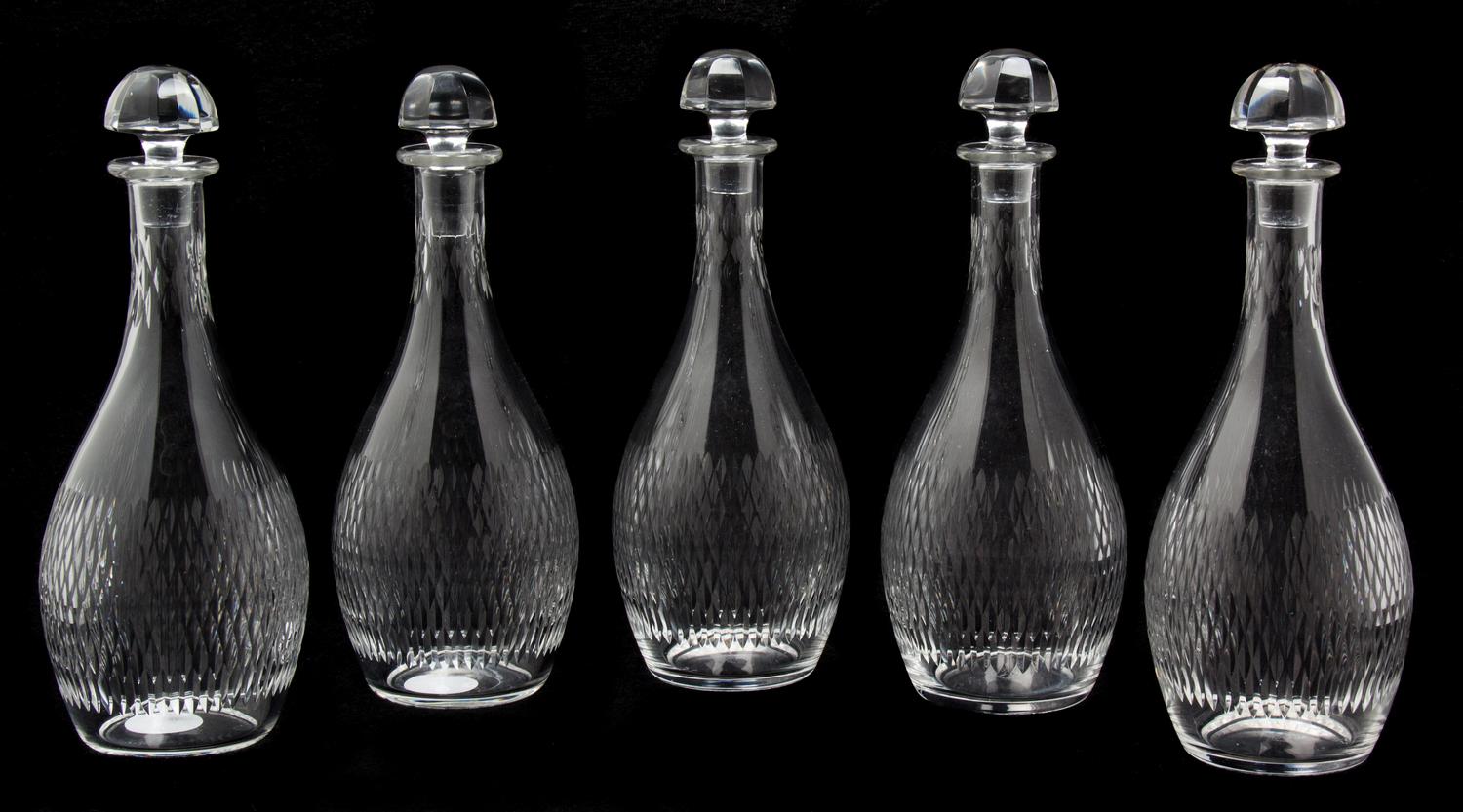 A Set of Five Baccarat Etched Glass Decanters Height 8 3/4 inches. — 20TH CENTURY