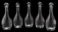 A Set of Five Baccarat Etched Glass Decanters Height 8 3/4 inches. — 20TH CENTURY