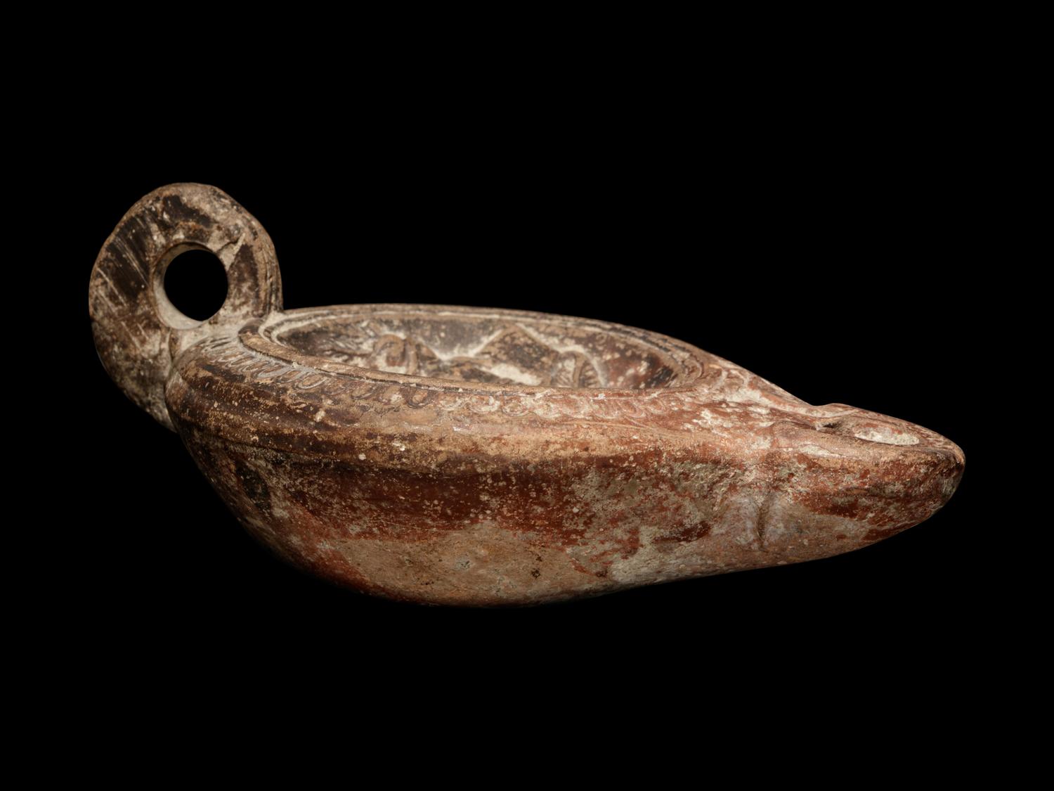 A Roman Terracotta Oil Lamp with Gladiators