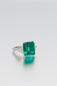 A Platinum, 18 Karat Yellow Gold, Emerald and Diamond Ring, Harry Winston, 6.20 dwts.