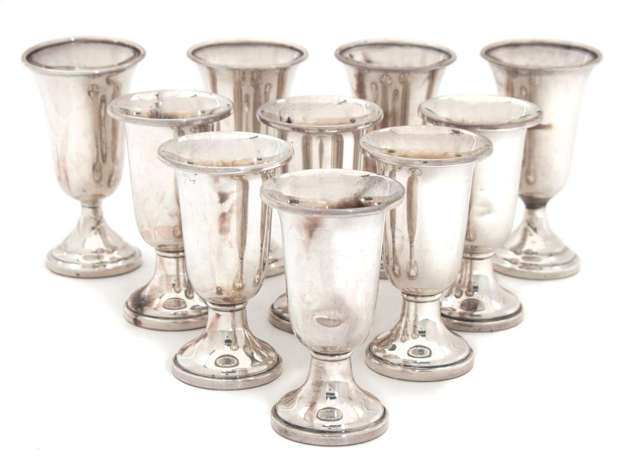 An Assembled Set of Ten Silver Cordials Height of tallest 3 1/4 inches.