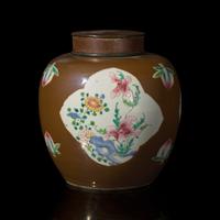 A Chinese Café-au-Lait Ground Famille Rose Jar, 18th Century — 清中期 烏金地開光粉彩花卉罐