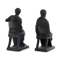 A Pair of Black Earthenware or Composition Figures