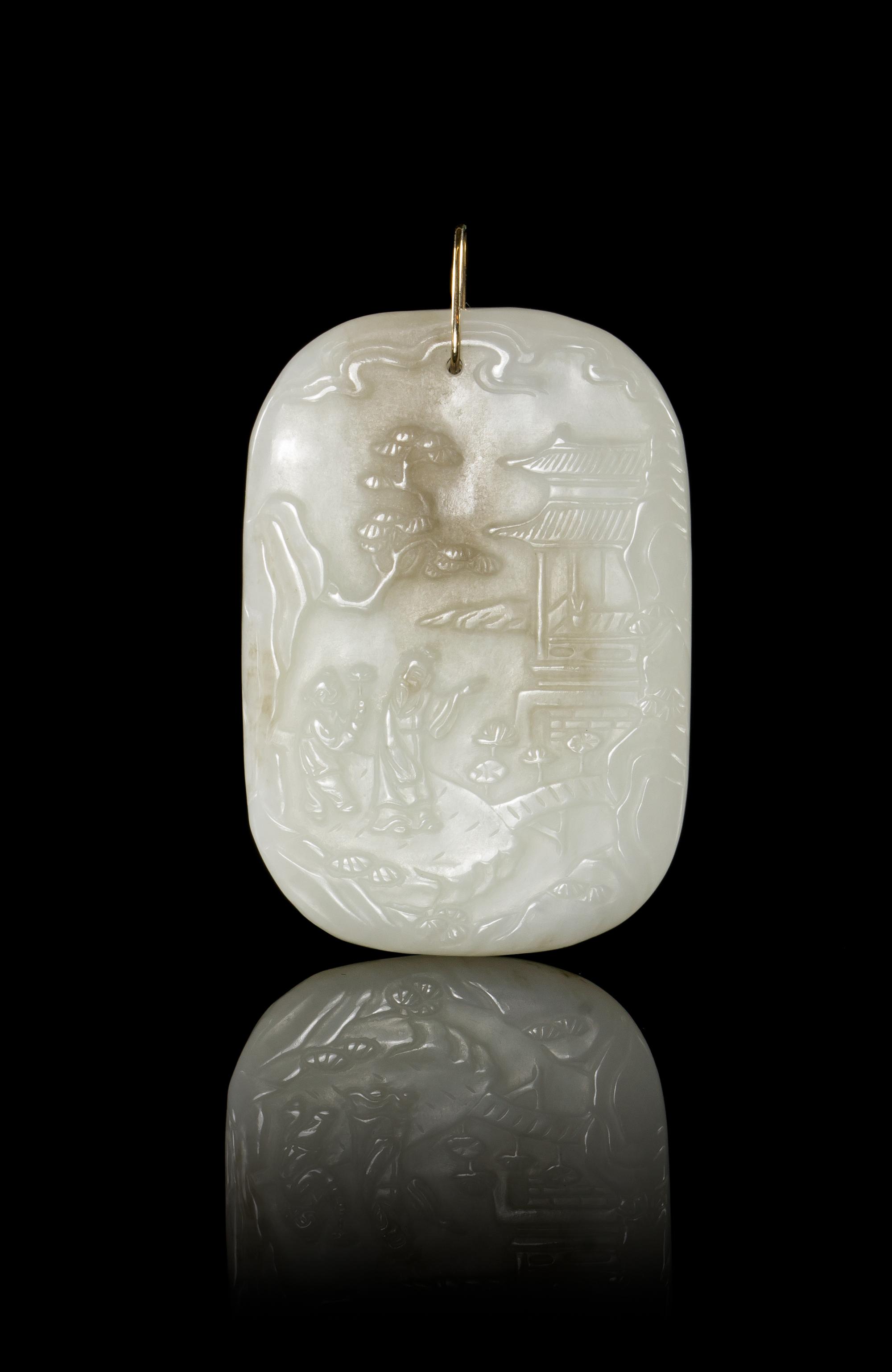 A Carved Jade Plaque Height 2 1/2 inches.