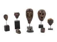 A Group of Eight Miniature Ethnographic Carved Masks