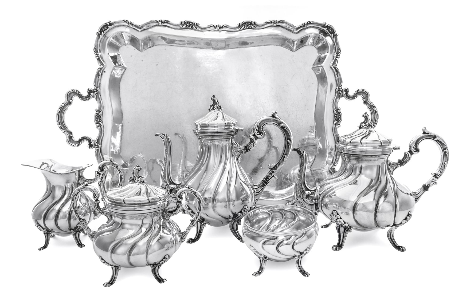 A Peruvian Silver Six-Piece Tea Service, Industria Peruana-Plata Estruina, 20th Century, comprising a teapot, coffee pot, covered sugar