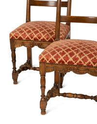 A Set of Six French Provincial Carved Walnut Dining Chairs