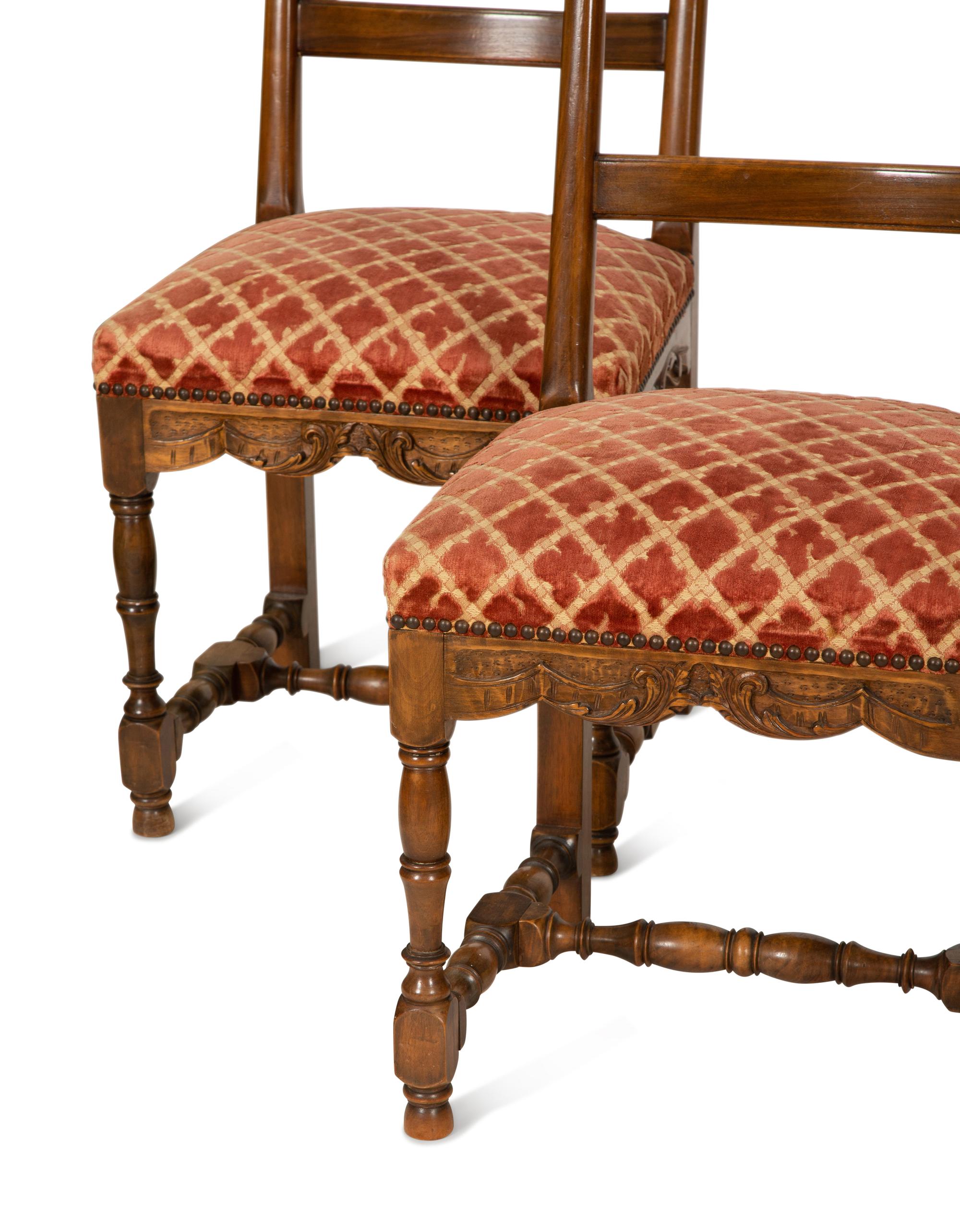 A Set of Six French Provincial Carved Walnut Dining Chairs