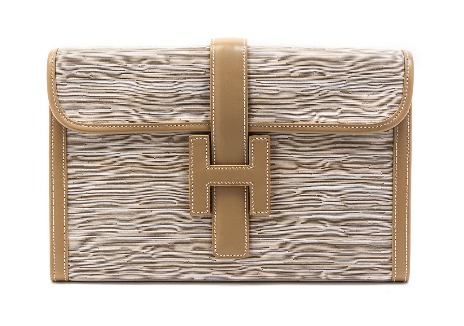 An Hermes Ivory Vibrato Leather Jige Clutch, 11 1/2 x 7 1/2 x 1 1/2 inches.
