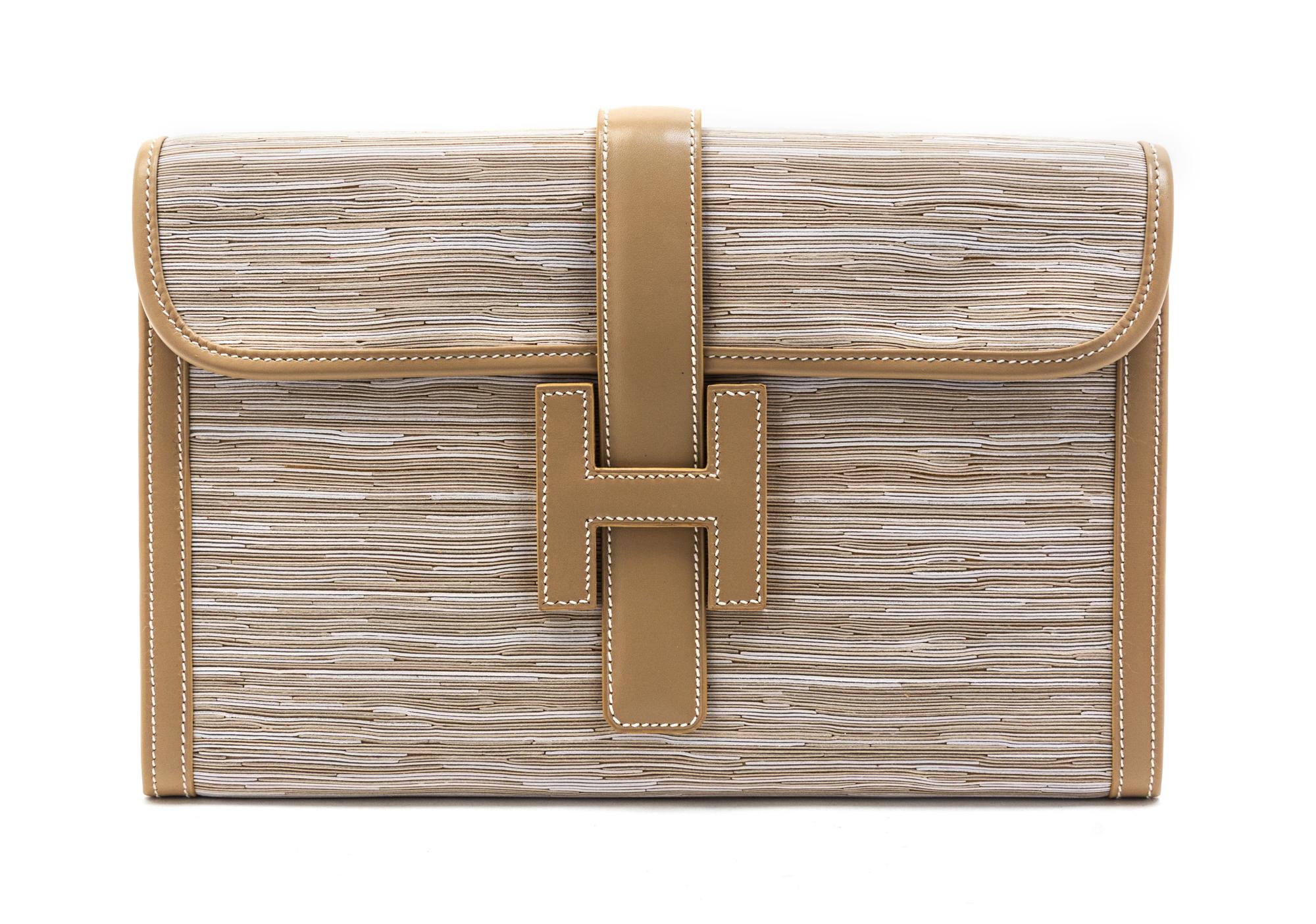 An Hermes Ivory Vibrato Leather Jige Clutch, 11 1/2 x 7 1/2 x 1 1/2 inches.