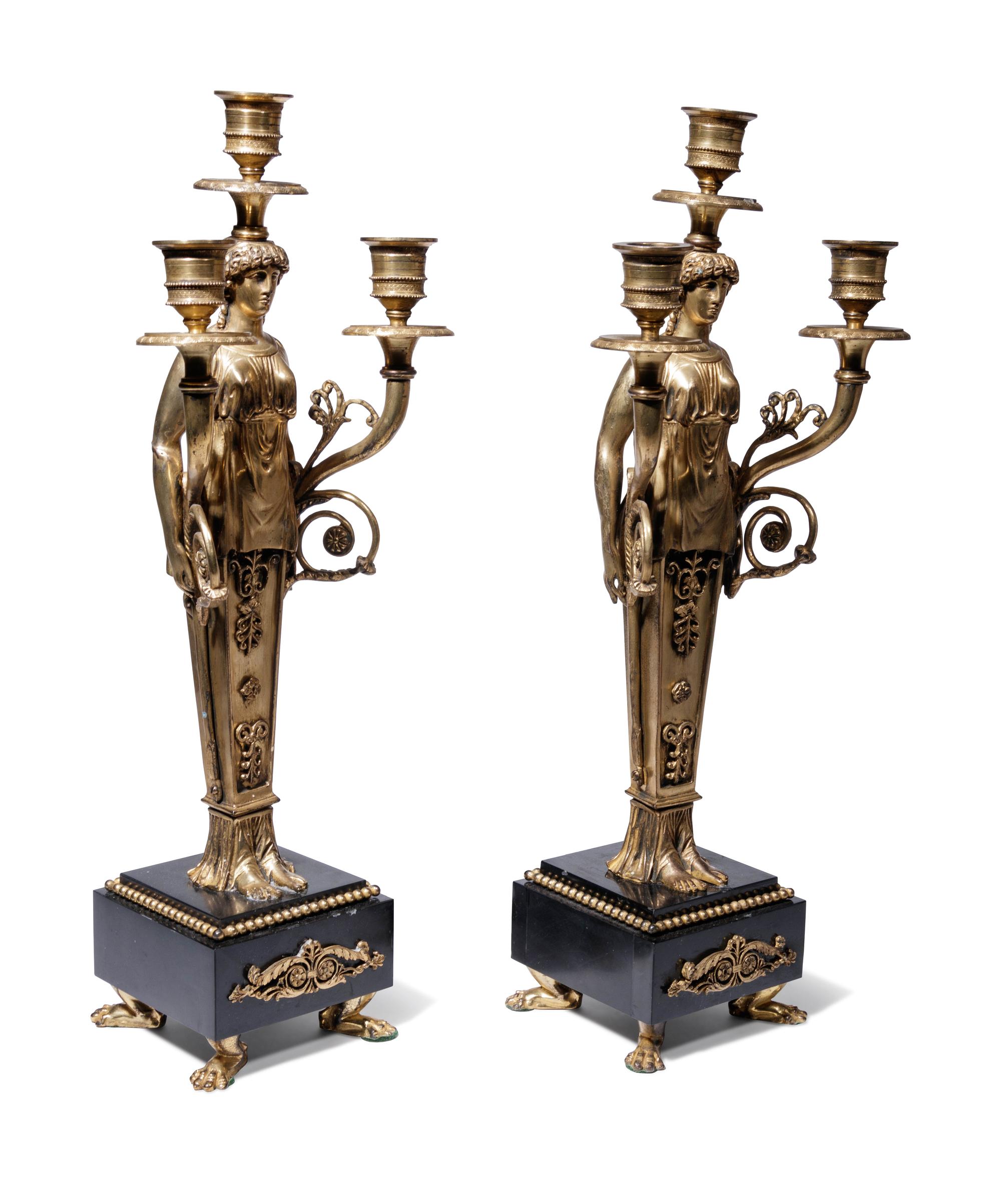 A Pair of Empire Style Gilt Bronze Figural Three-Light Candelabra