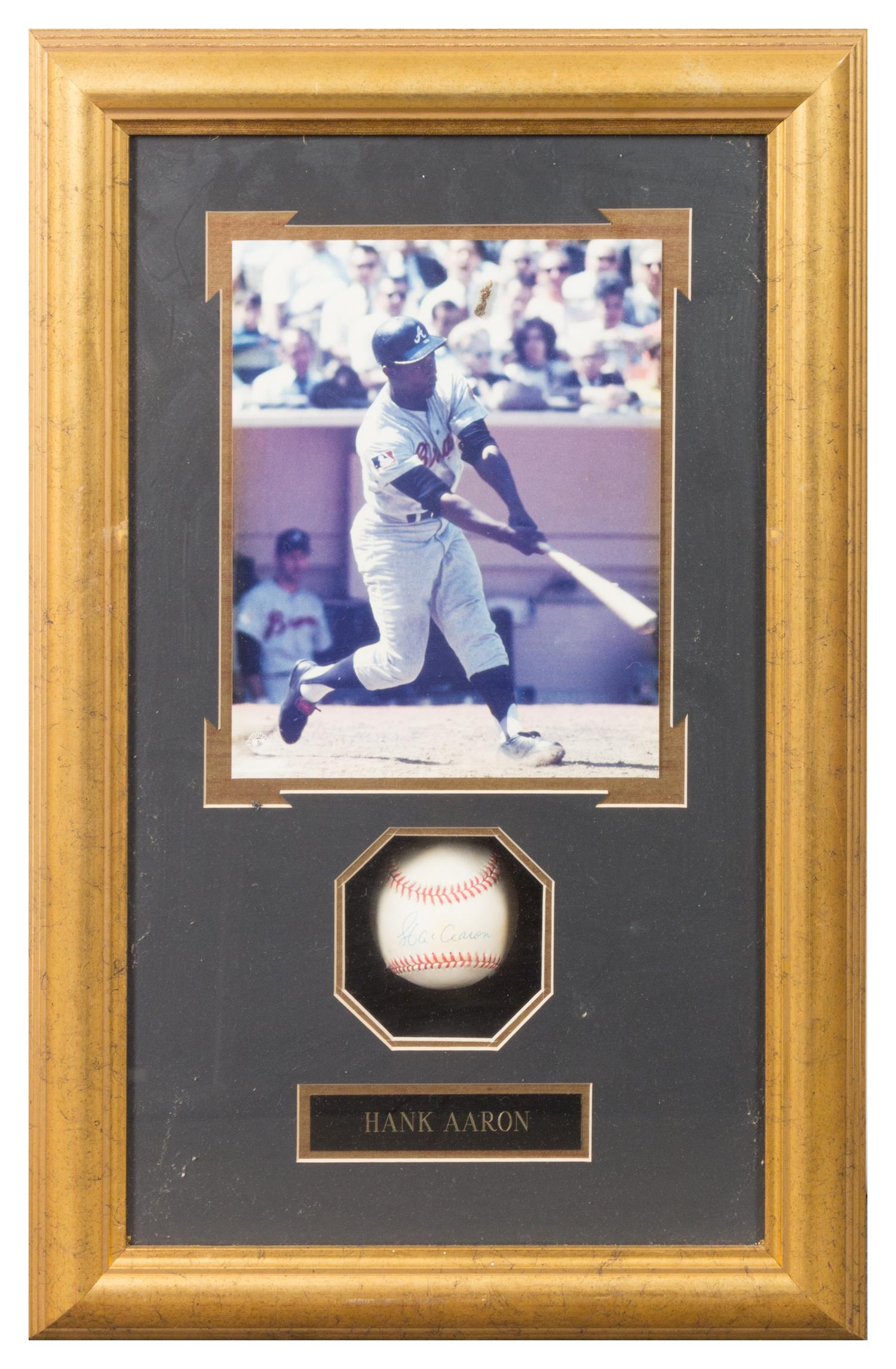 A Hank Aaron Autographed Baseball 24 1/2 x 15 3/4 inches overall.