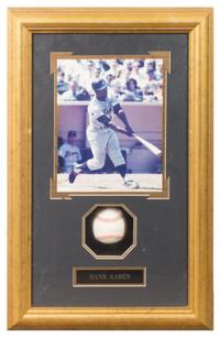 A Hank Aaron Autographed Baseball 24 1/2 x 15 3/4 inches overall.