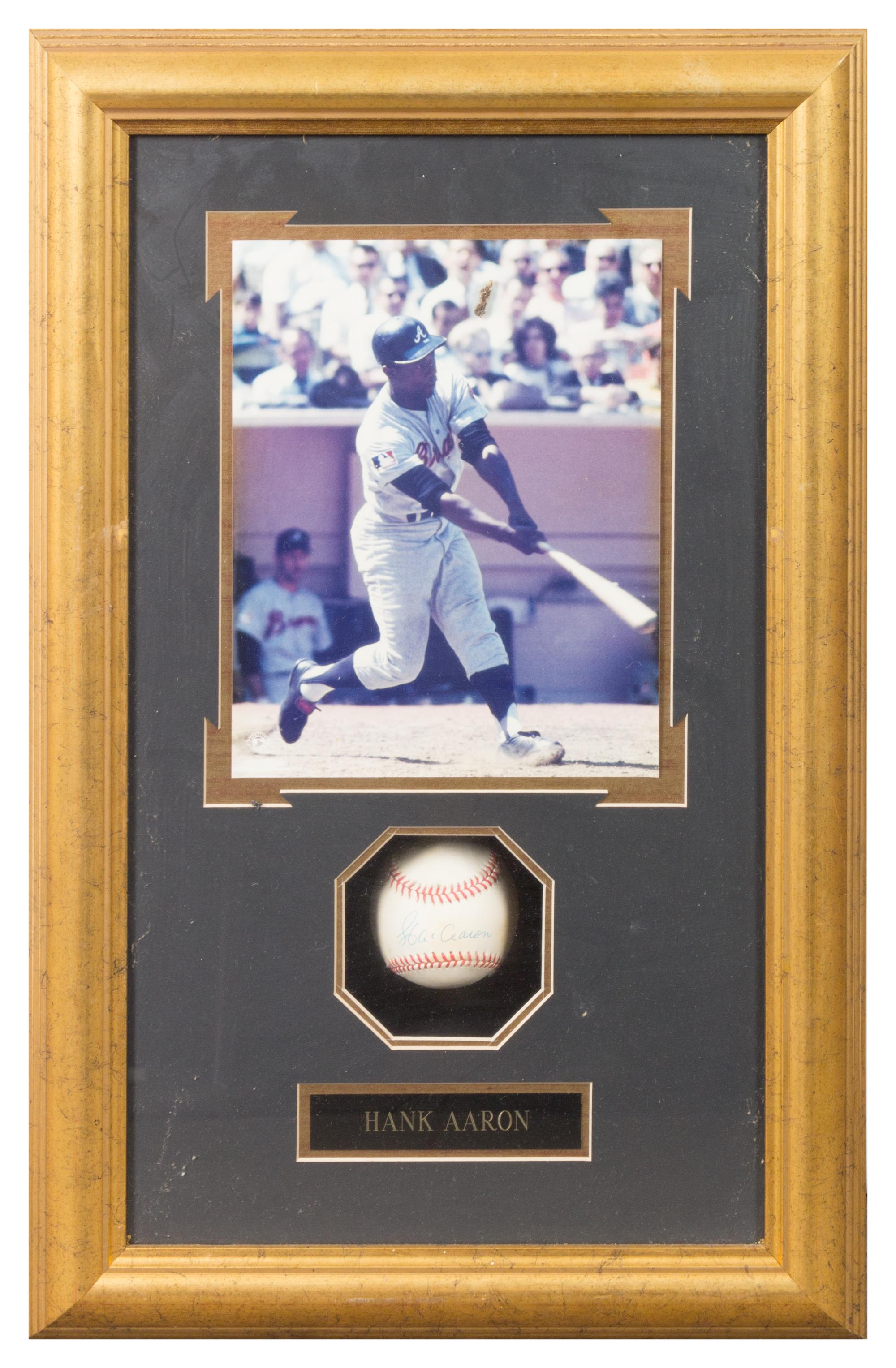 A Hank Aaron Autographed Baseball 24 1/2 x 15 3/4 inches overall.