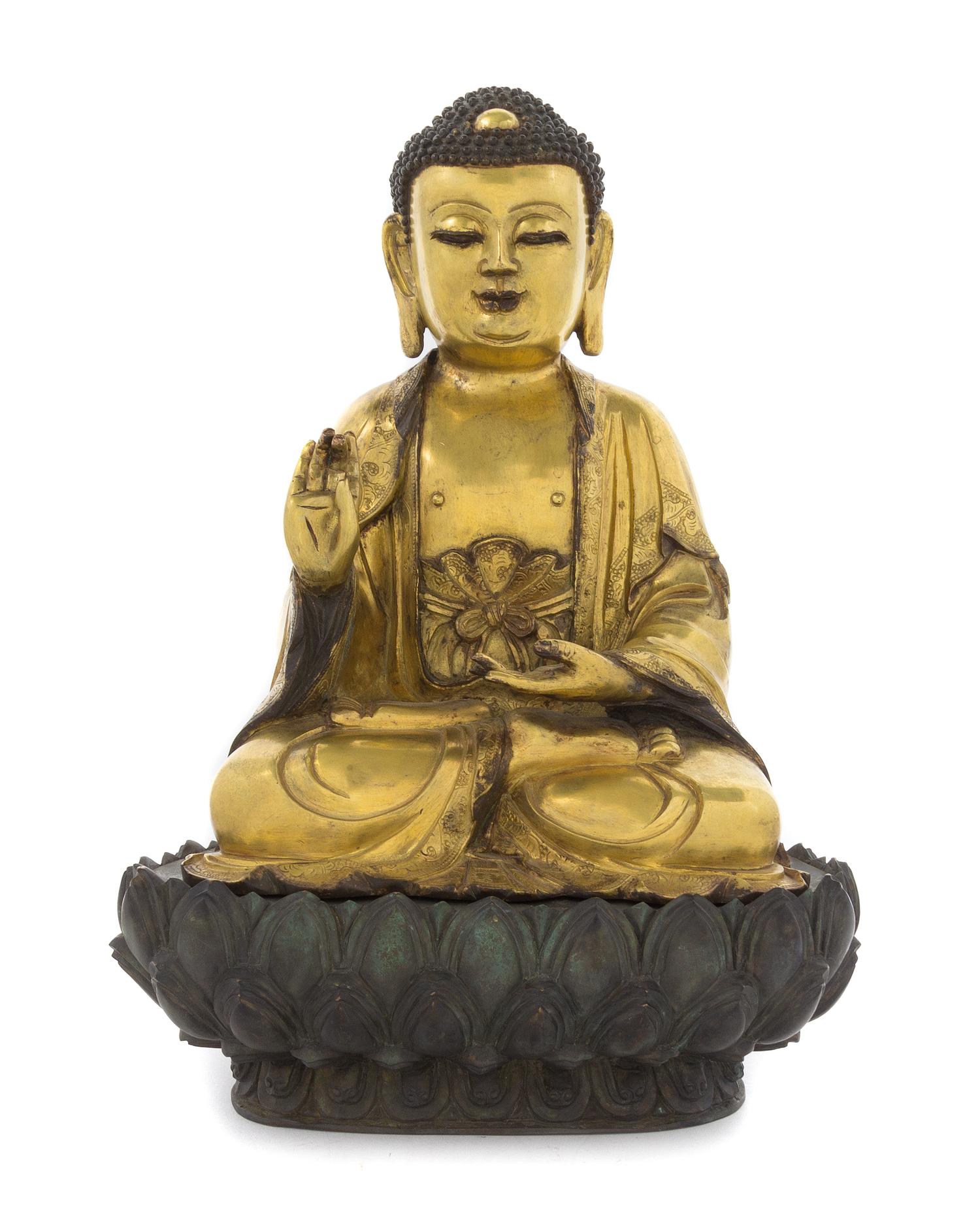 A Gilt Bronze Figure of Buddha Height overall 14 inches.