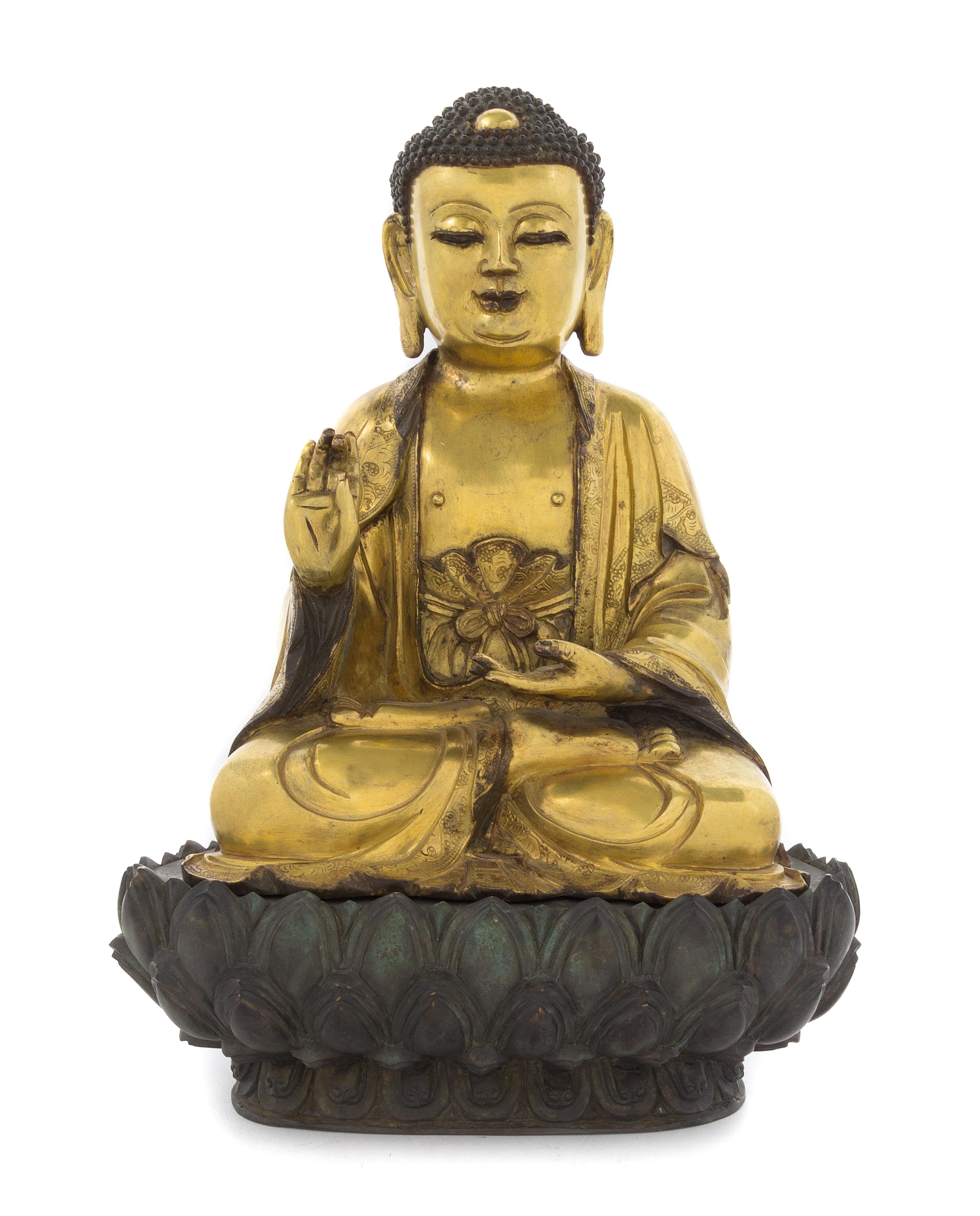 A Gilt Bronze Figure of Buddha Height overall 14 inches.