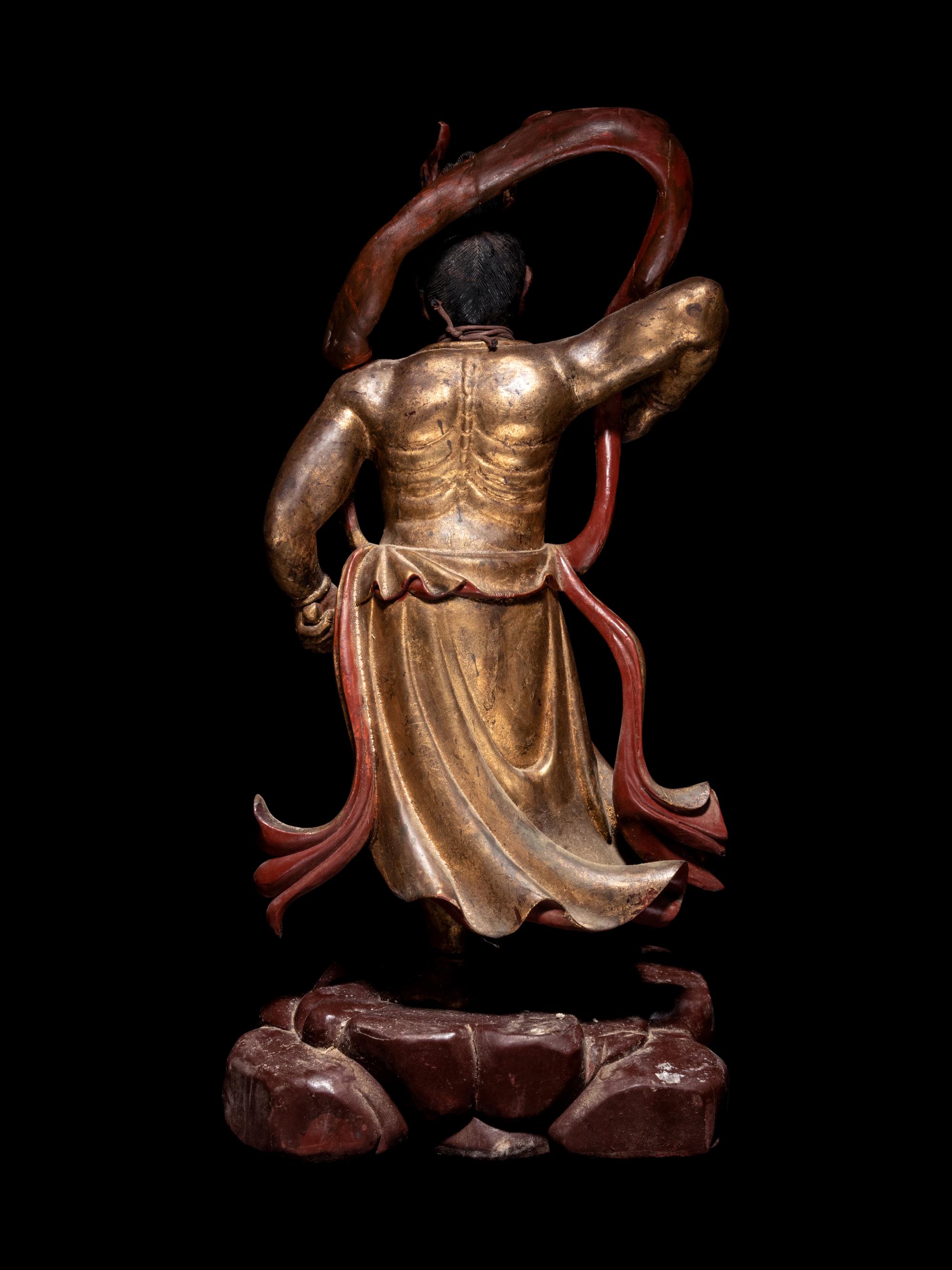 A Pair of Gilt and Red Lacquered Wood Figures of Guardians