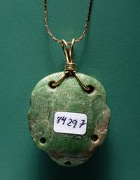 A Chontal Jade Maskette Pendant Necklace with Gold Chain