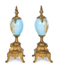 A Pair of Sèvres Style Porcelain Small Urns with Gilt Metal Mounts