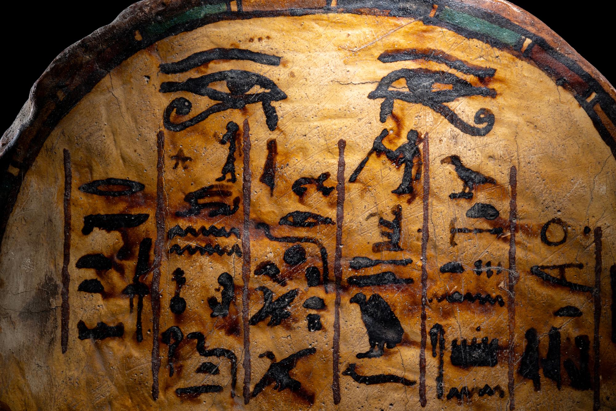 An Egyptian Painted Wood Round-Top Stele
