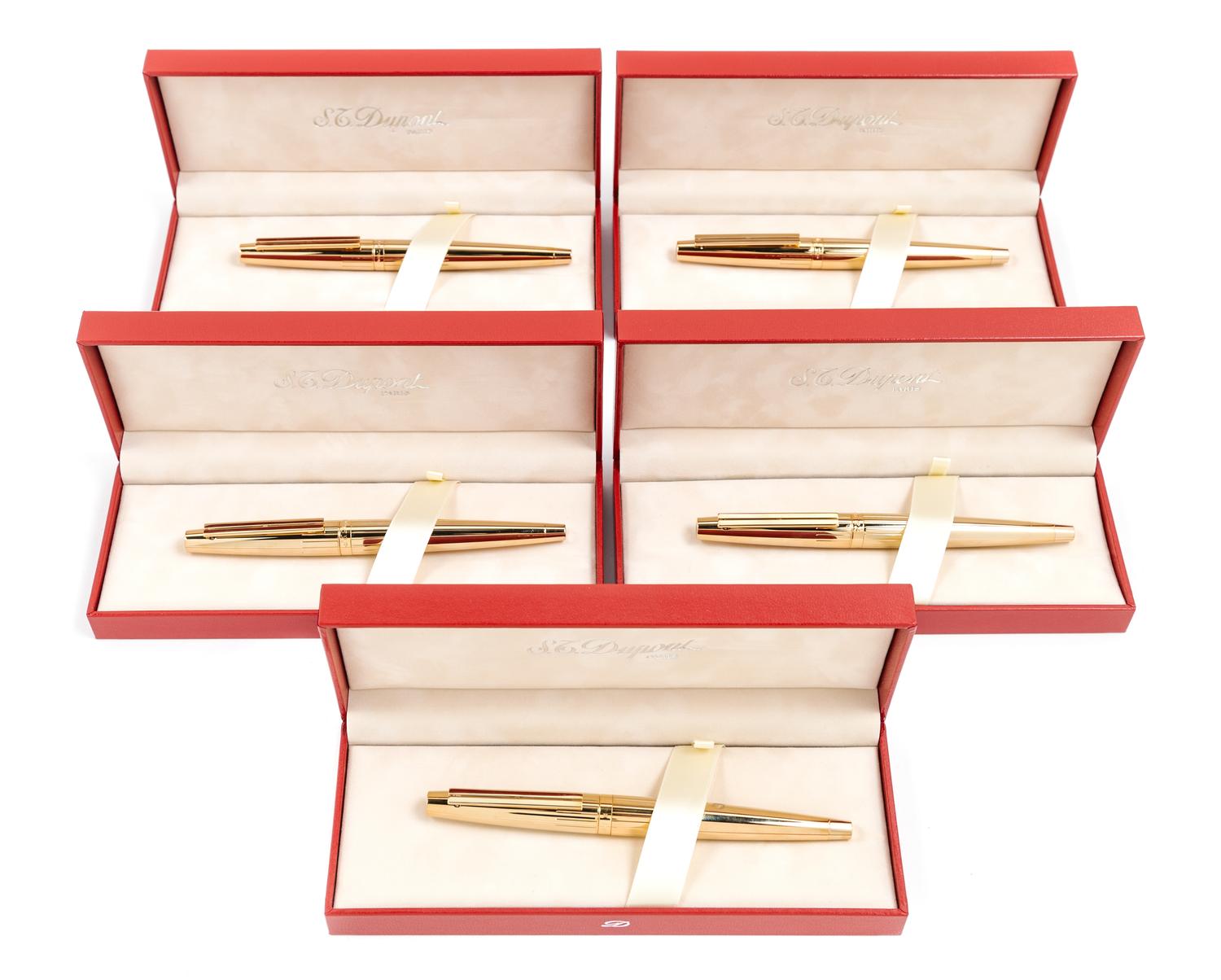 A Group of Five S.T. Dupont Gold-Plated Ellipsis Fountain Pens