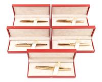 A Group of Five S.T. Dupont Gold-Plated Ellipsis Fountain Pens