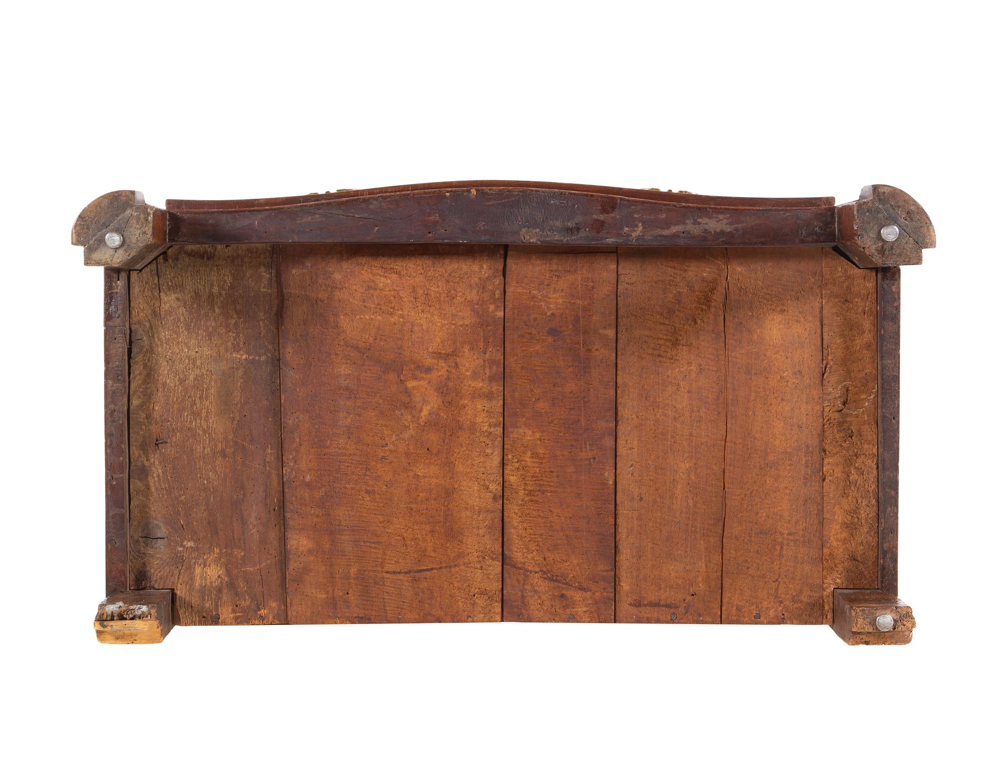 A Régence Gilt Metal Mounted Carved Walnut Serpentine Commode