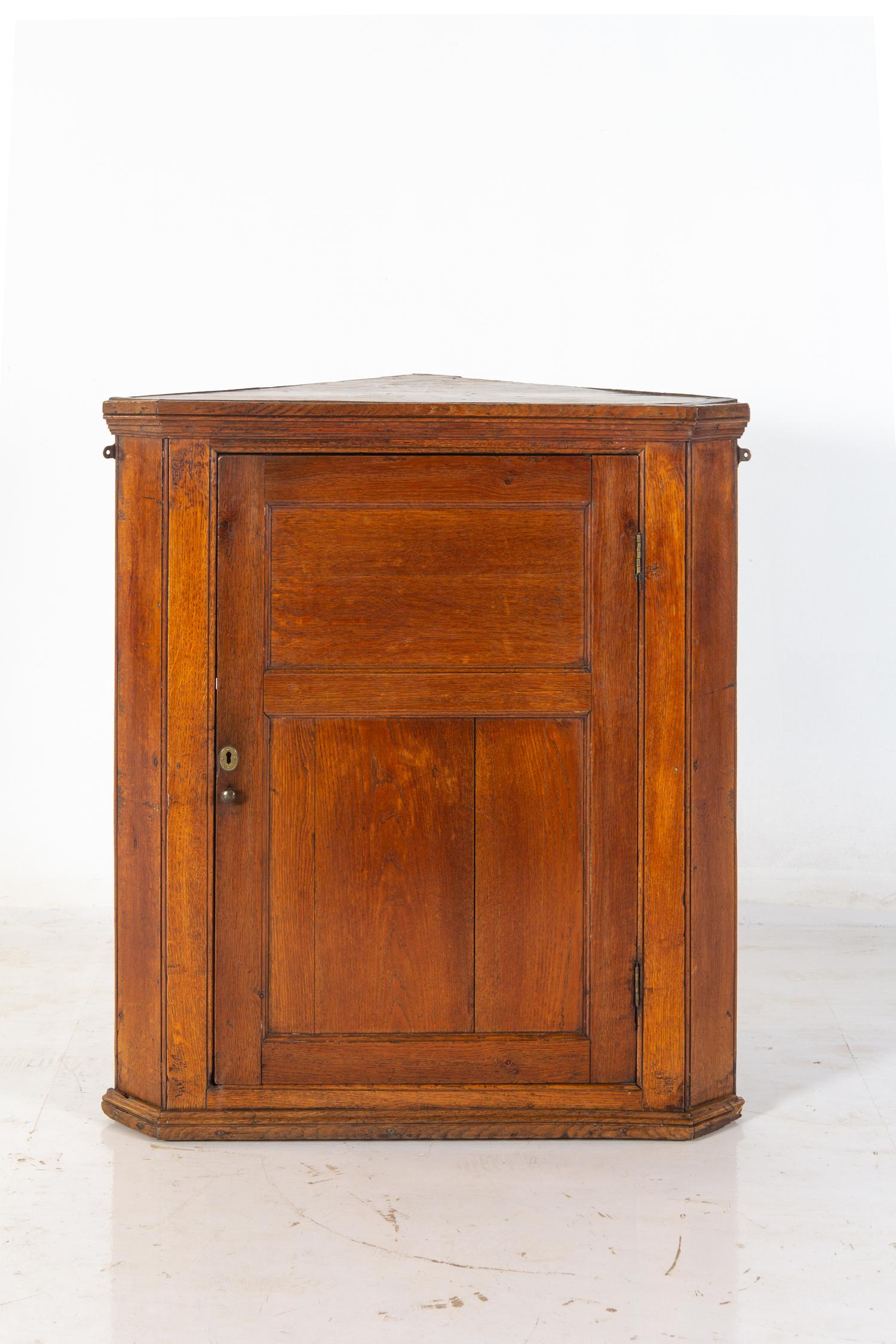 A George III Oak Hanging Corner Cupboard