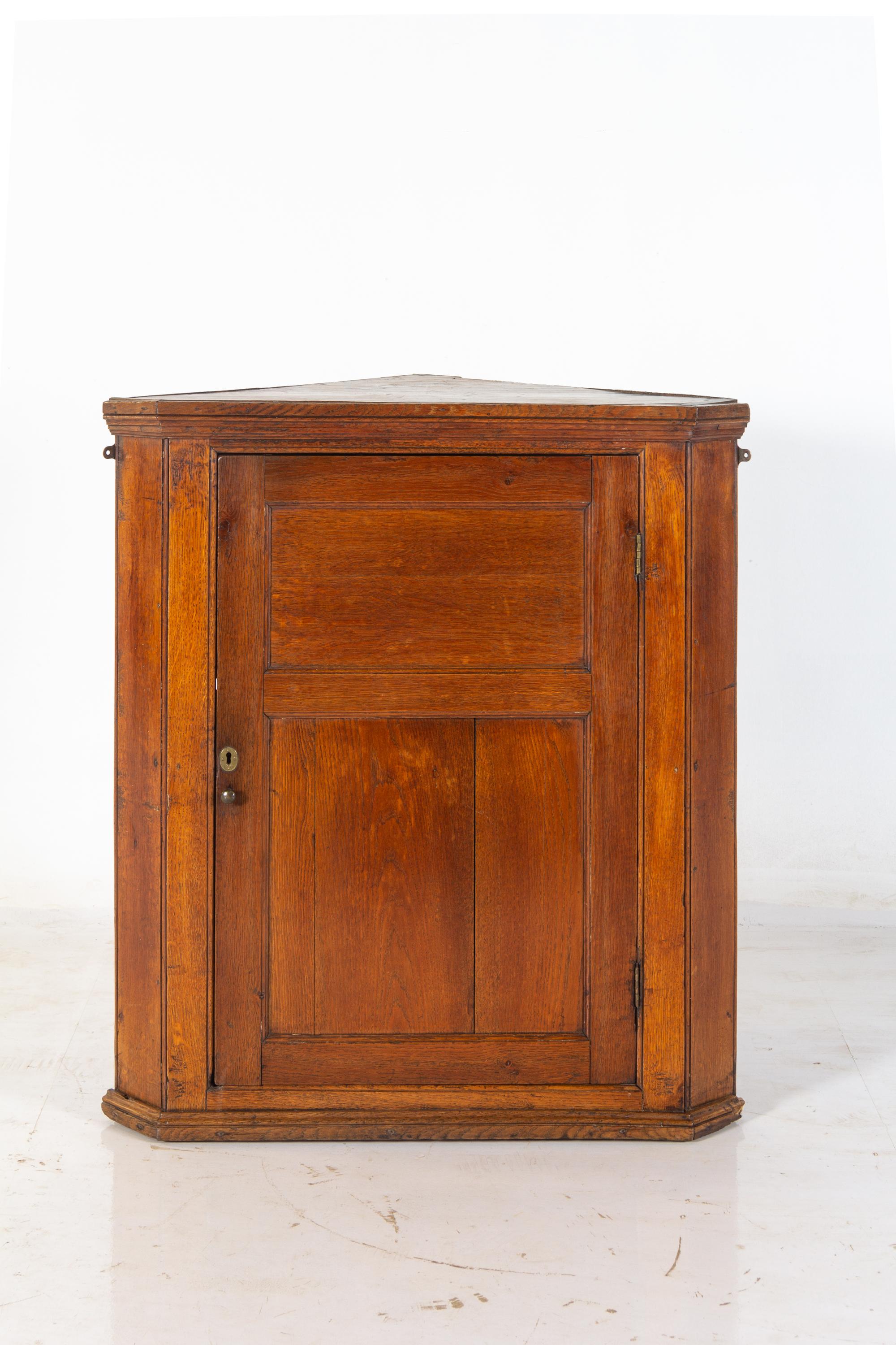 A George III Oak Hanging Corner Cupboard