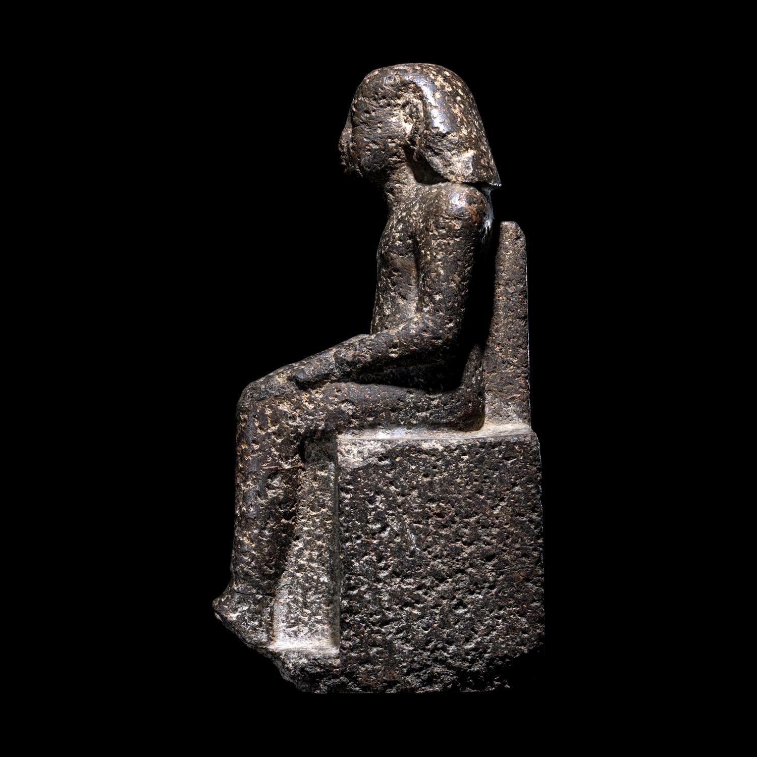 An Egyptian Diorite Seated Figure