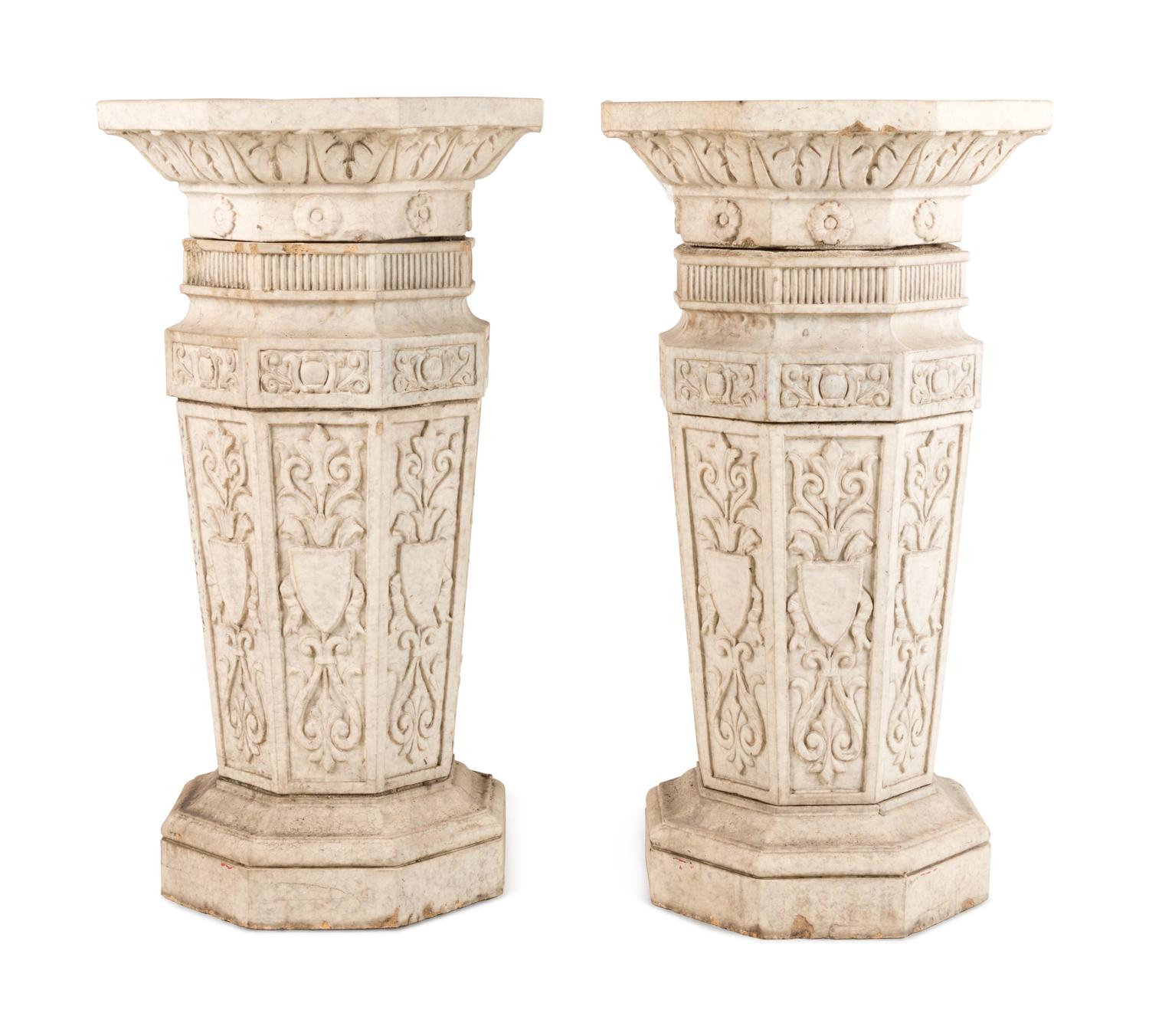 A Pair of Glazed Terra Cotta Urns and Pedestals