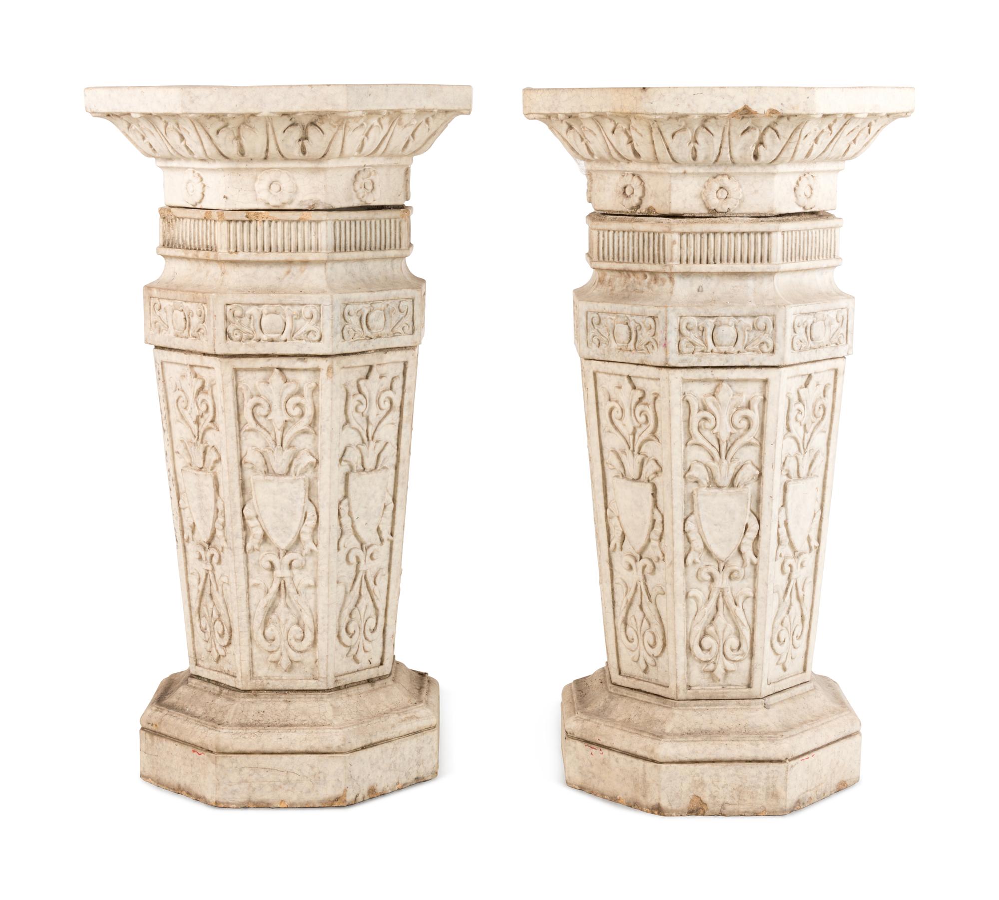 A Pair of Glazed Terra Cotta Urns and Pedestals