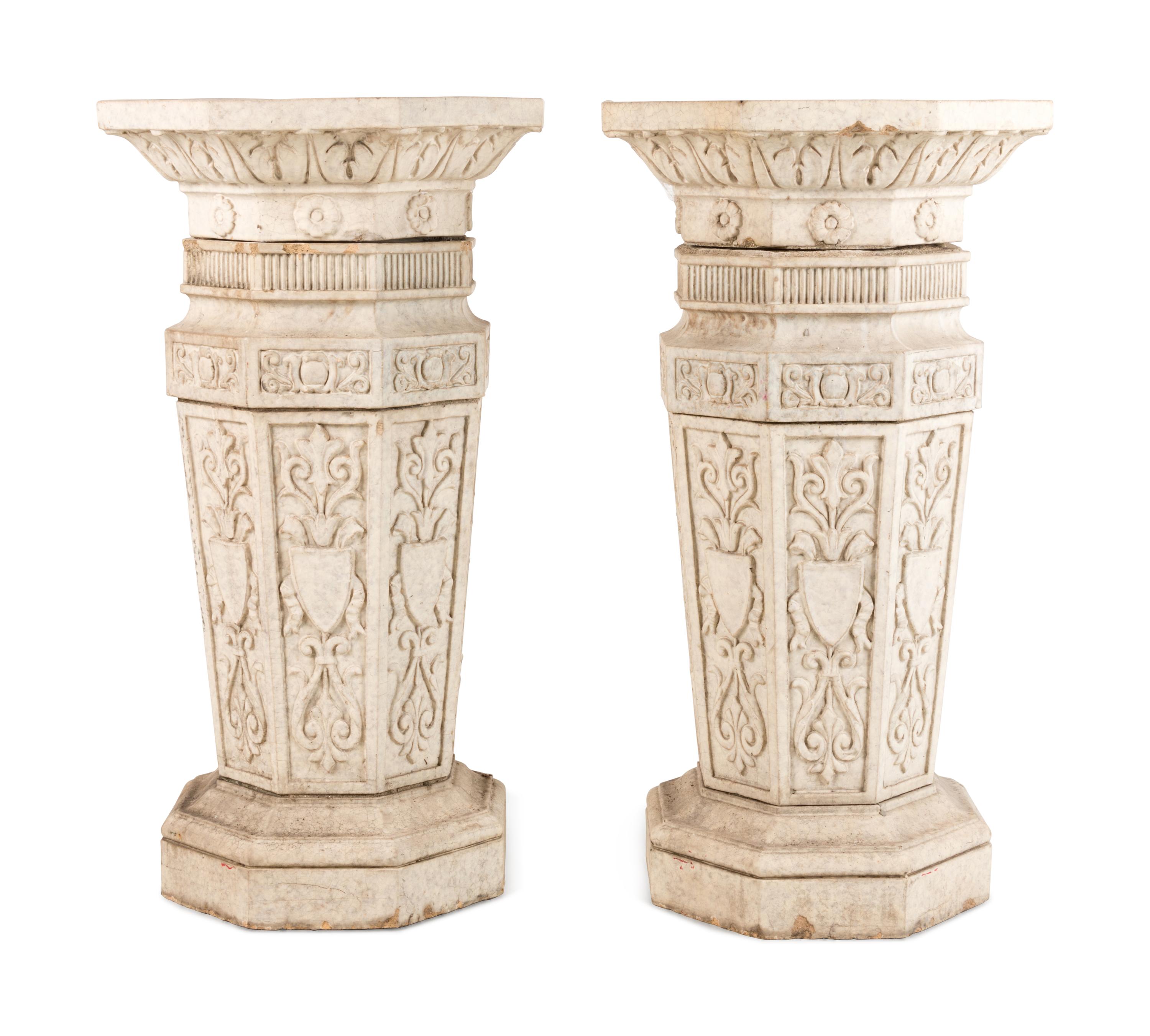 A Pair of Glazed Terra Cotta Urns and Pedestals