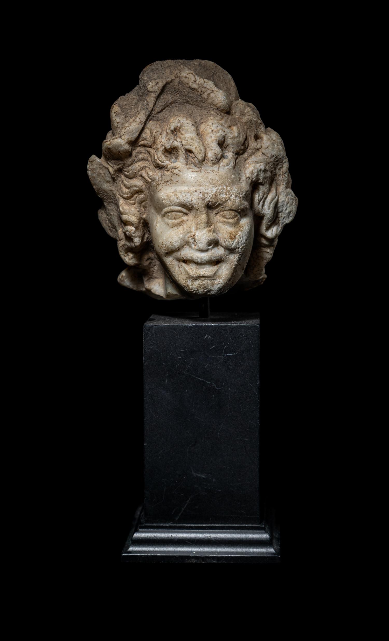 A Roman Marble Head of a Satyr