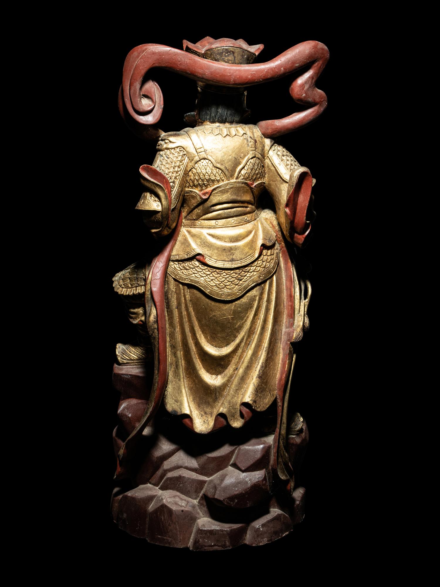 A Set of Four Gilt and Red Lacquered Wood Figures of Guardians