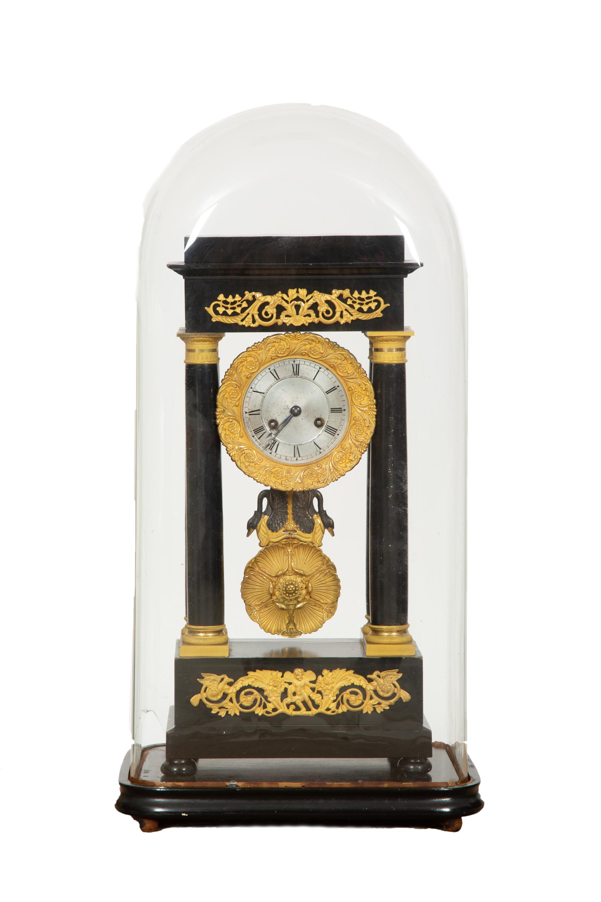 A Charles X Gilt Bronze Mounted Ebonized Portico Clock