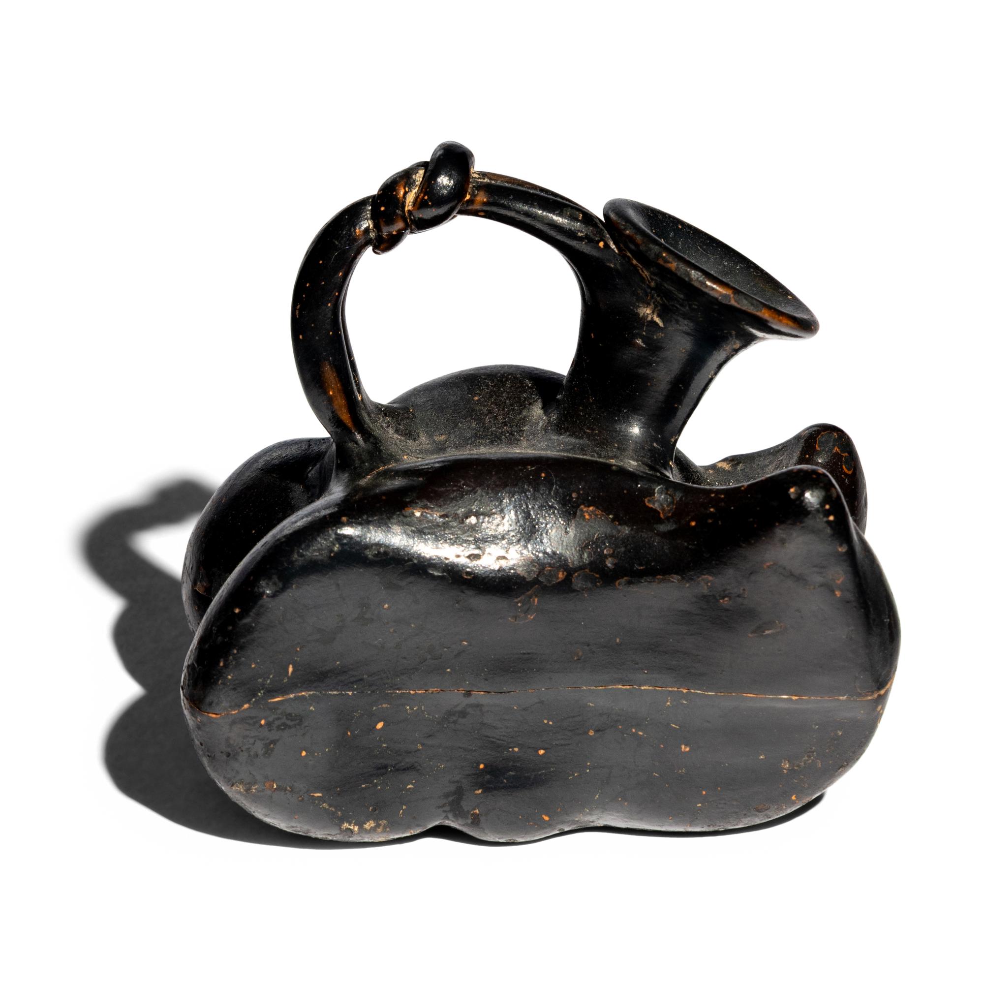 A Greek Black-Glazed Figural Askos