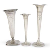Three American sterling silver chased and engraved trumpet vases various makers, 20th century