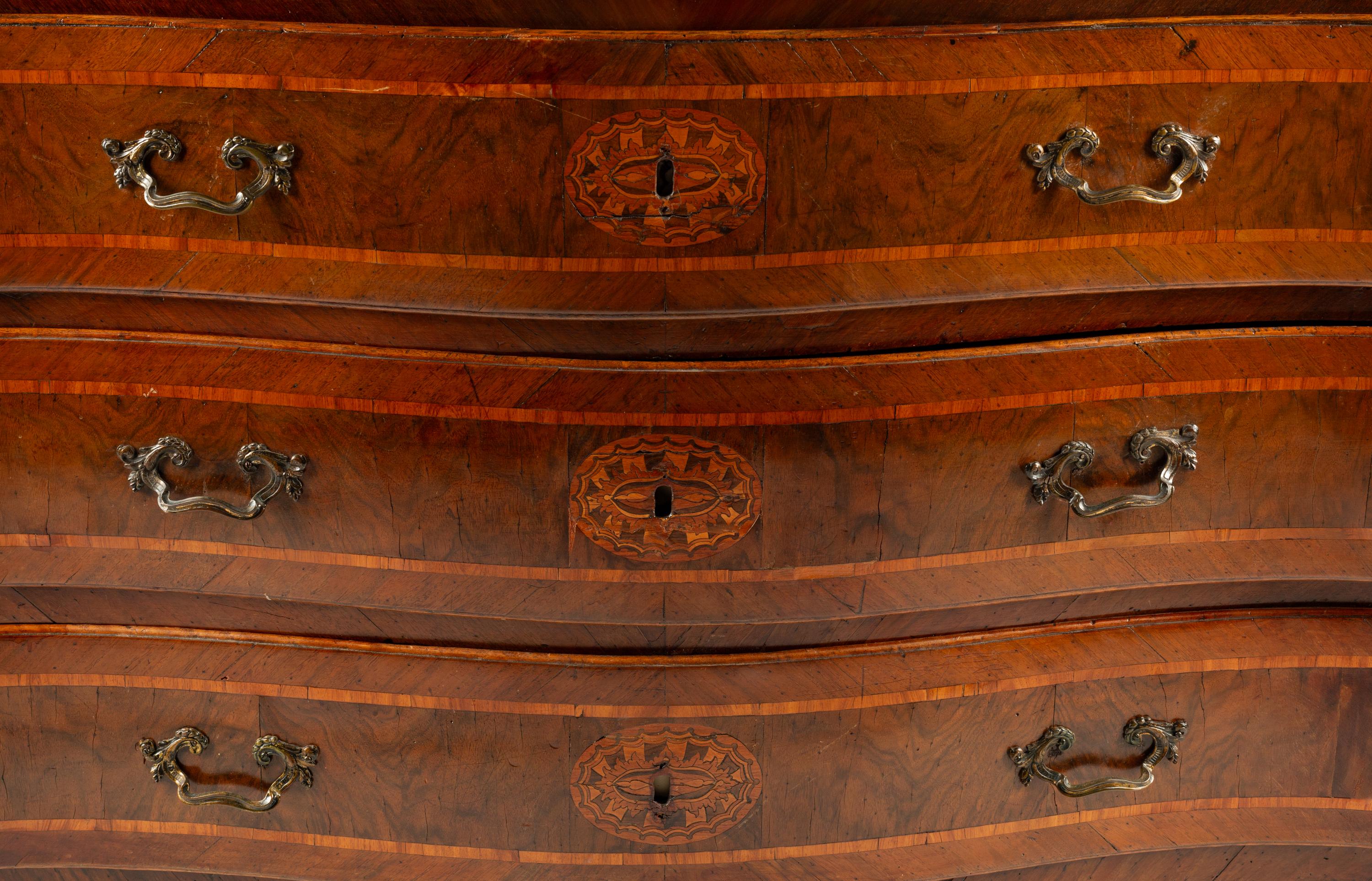 An Italian Walnut and Marquetry Marble-Top Commode