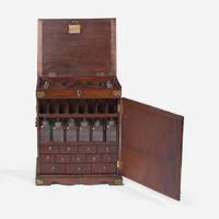 A George II carved mahogany apothecary cabinet circa 1740