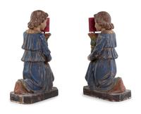 A Pair of Italian Carved and Polychrome Decorated Figural Candlesticks