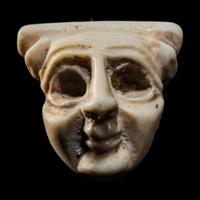 A Sumerian Limestone Face Amulet
