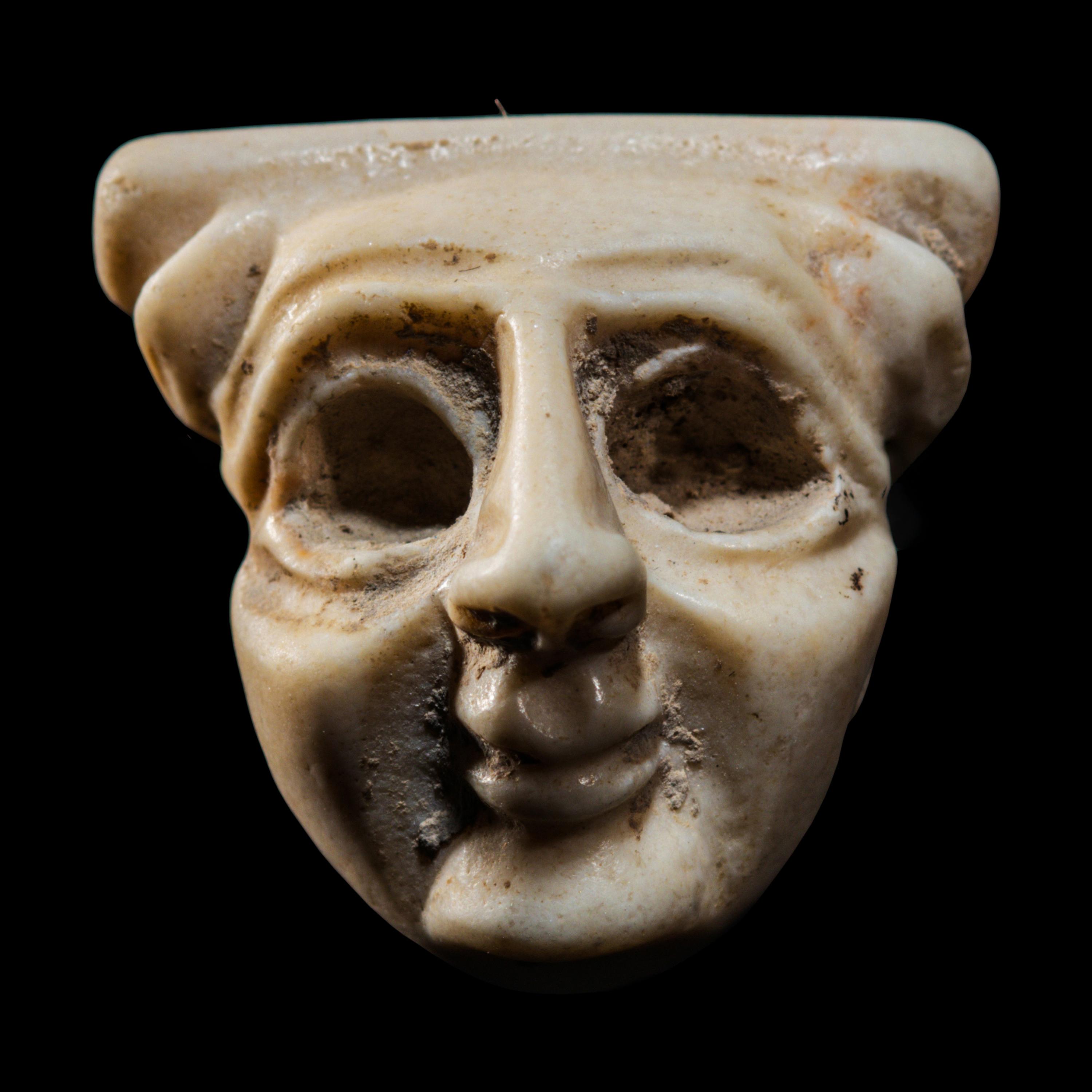 A Sumerian Limestone Face Amulet