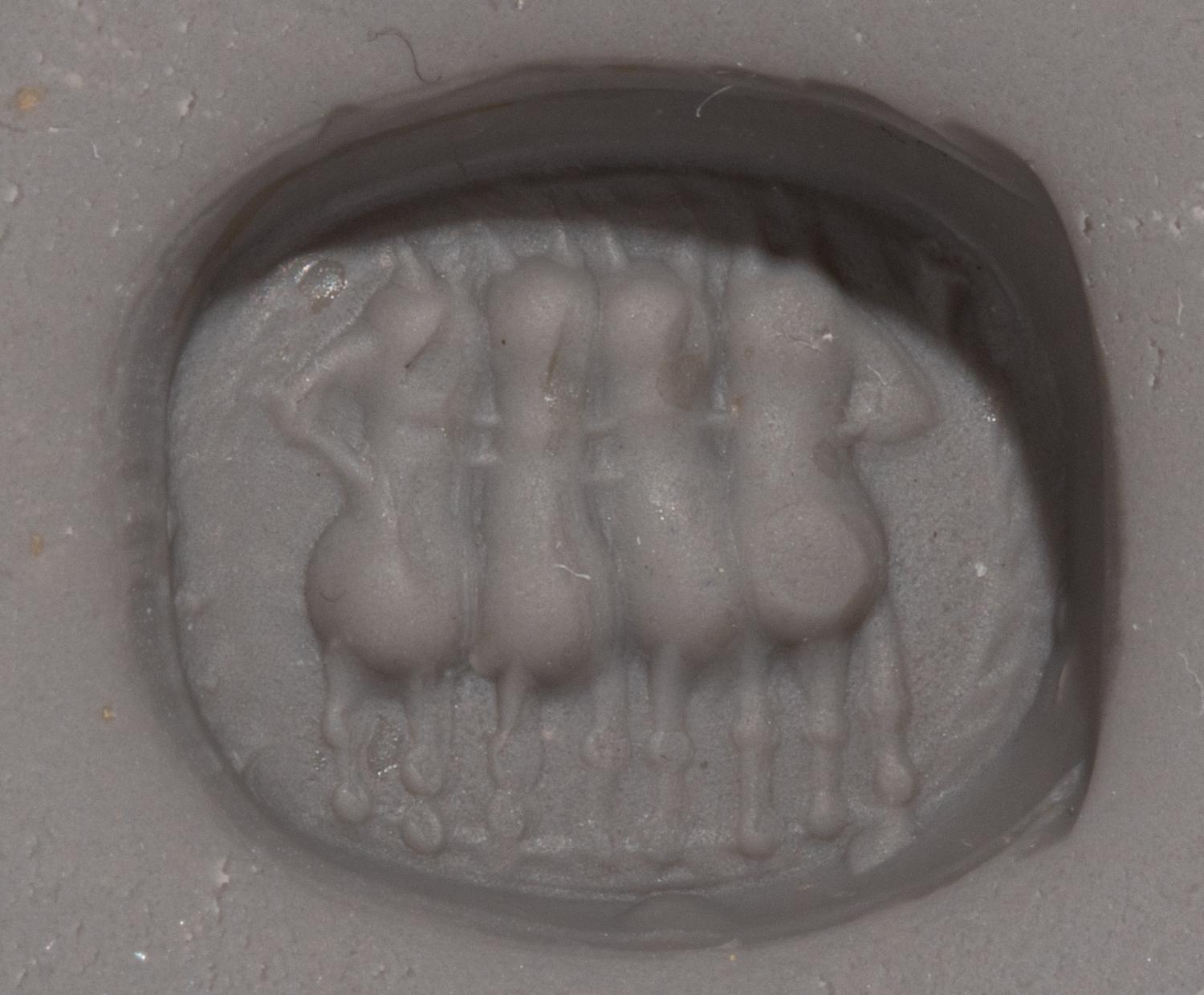 An Etruscan Carnelian Scarab with a Quadriga