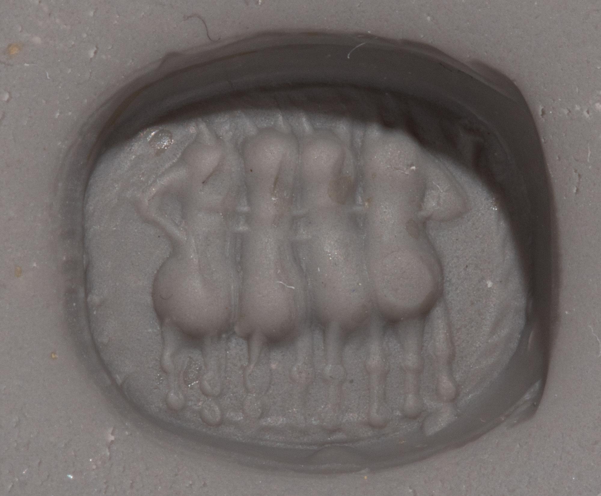An Etruscan Carnelian Scarab with a Quadriga